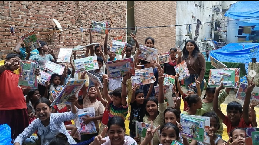 Children receiving learning kits through a Bharte Kadam Foundation campaign