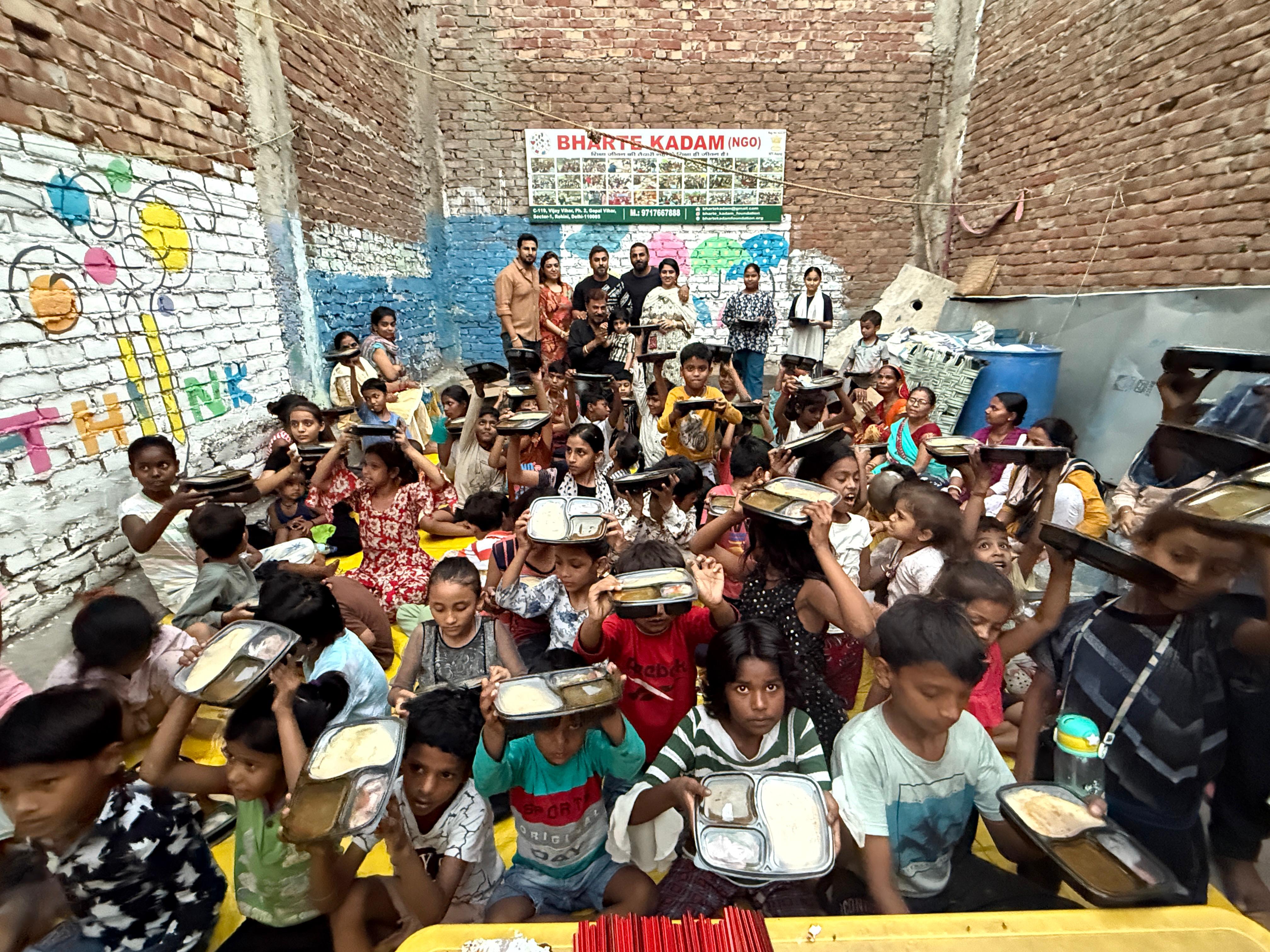 Children sharing a sponsored meal with Bharte Kadam Foundation