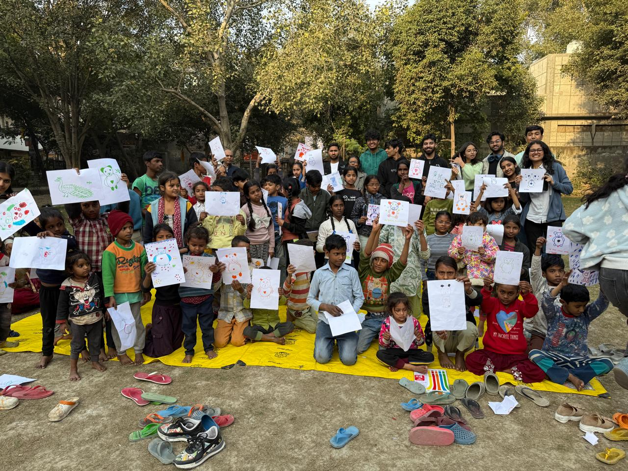 Children showing drawings during a community activity