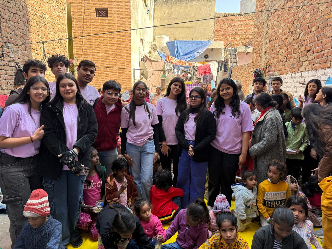 Volunteers and children during a Bharte Kadam Foundation community drive